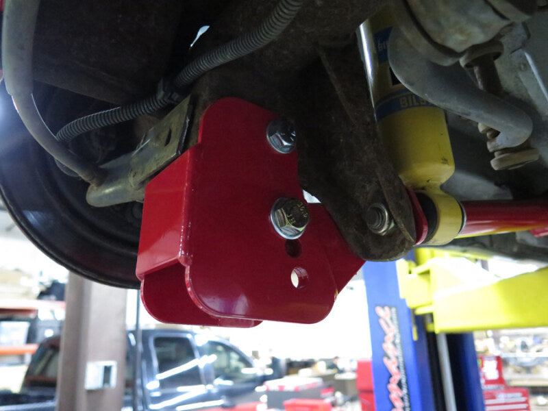 UMI Performance 2012-R Lower Control Arm Relocation Brackets Bolt-In Red