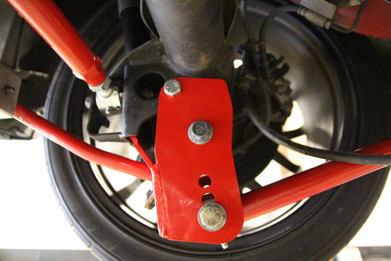 UMI Performance 1060-R Rear Control Arm Relocation Brackets Bolt-In Red